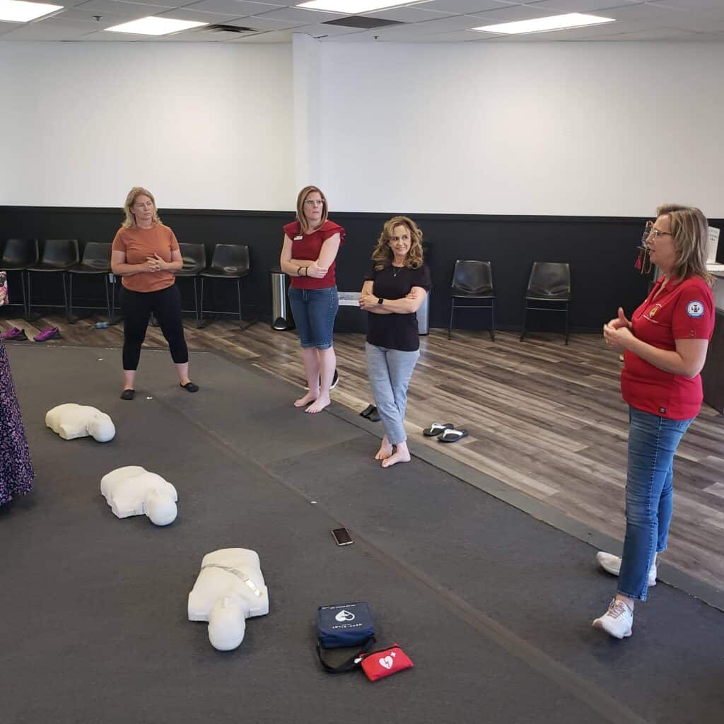 Center Sphere Caring Community Chapter Learning CPR with Deanna